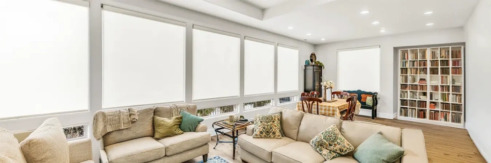 white roller shades in a large living room